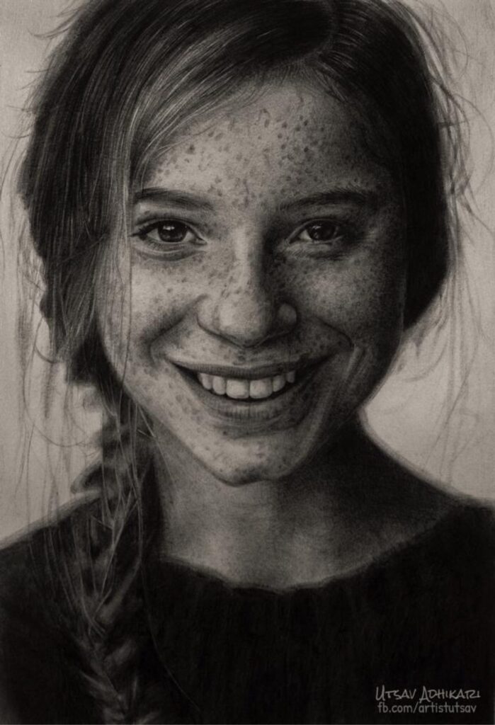 Graphite pencil portrait of a smiling girl with freckles, by Utsav Adhikari